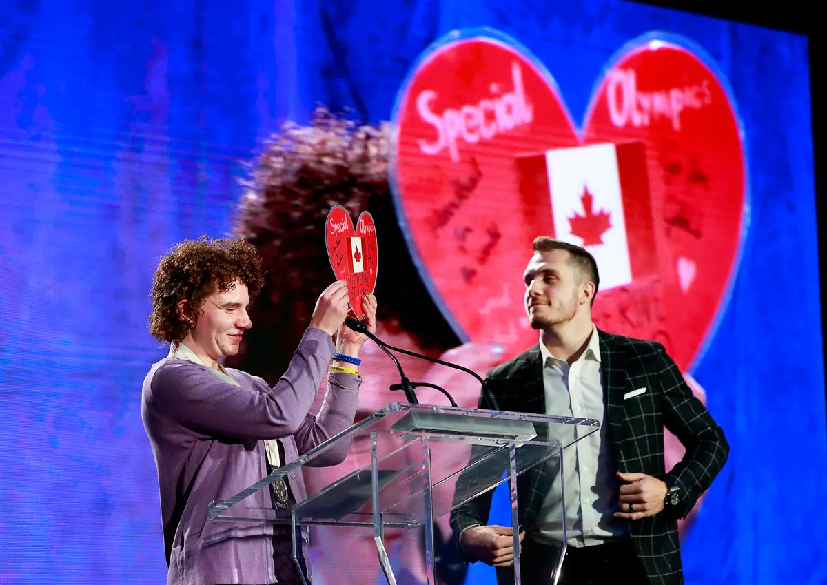 A Special Olympics heart raised on stage