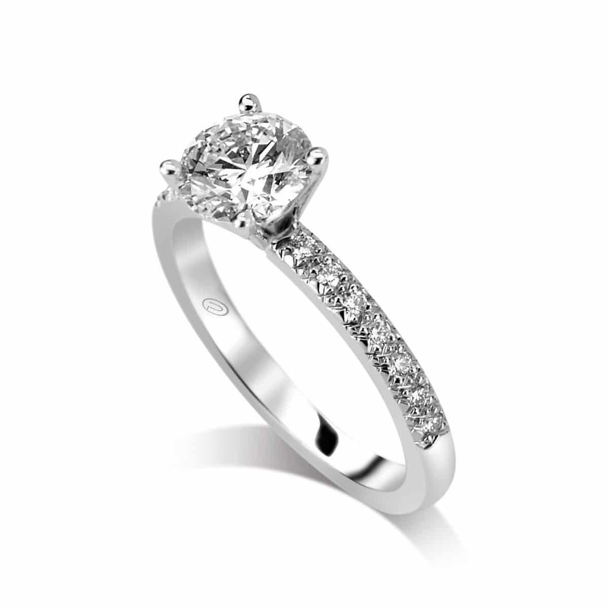 Classic Rock Between Small White Diamonds Engagement Ring